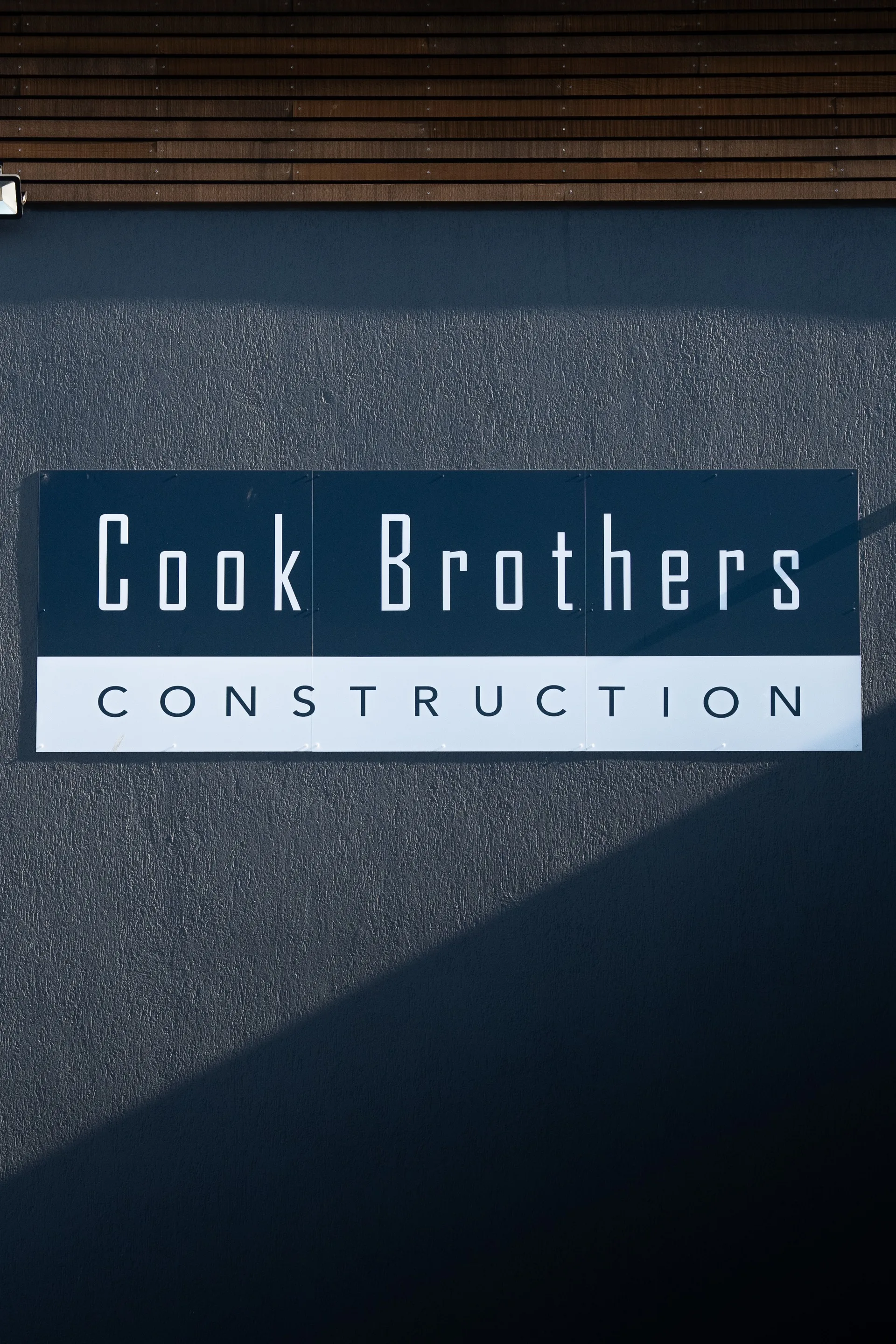 Cook Brothers Construction — facade lettering closeup