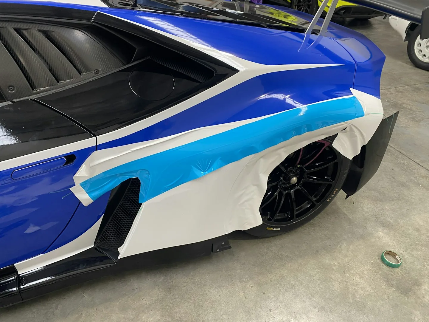Mag & Turbo Lamborghini — stripe work being laid over the base layers with knifeless tape in place