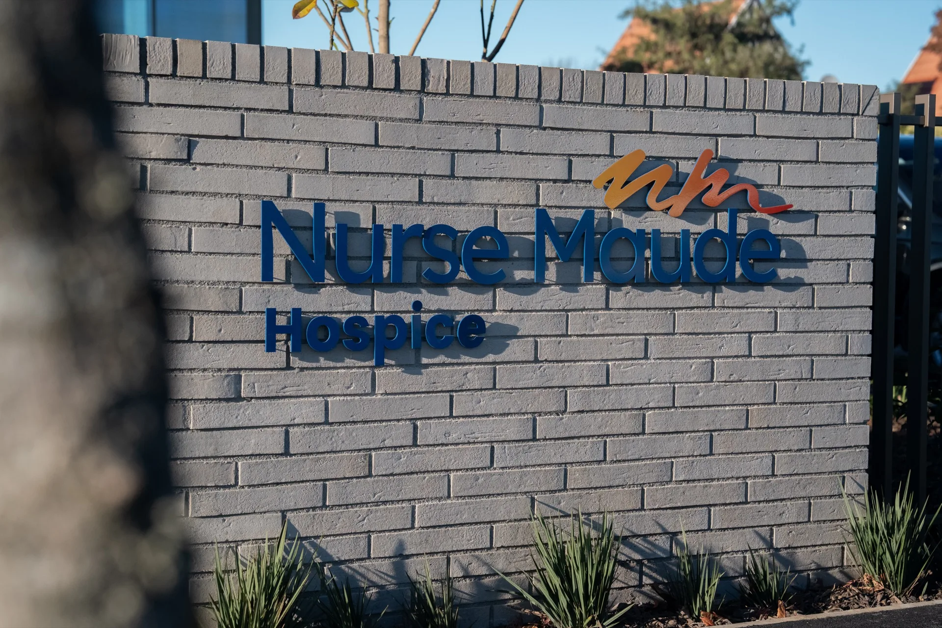 Nurse Maude Hospice — Brick signage closeup