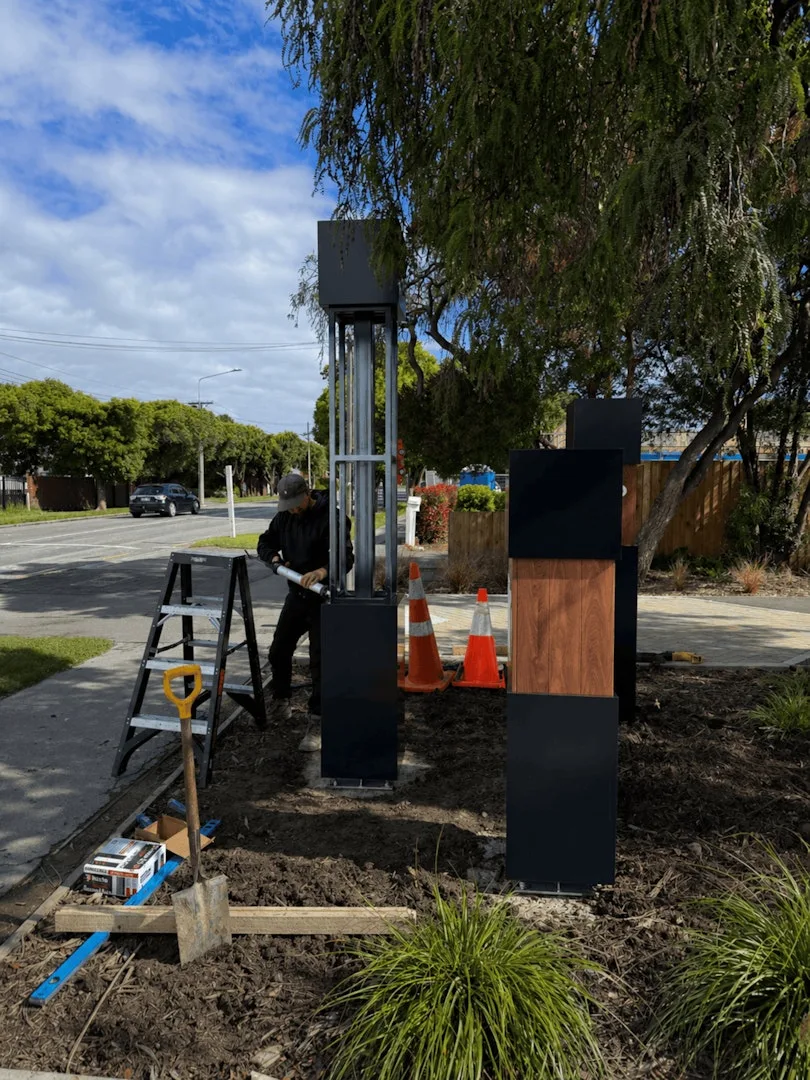 Te Parito Kōwhai — on-site install with the steel frame still exposed
