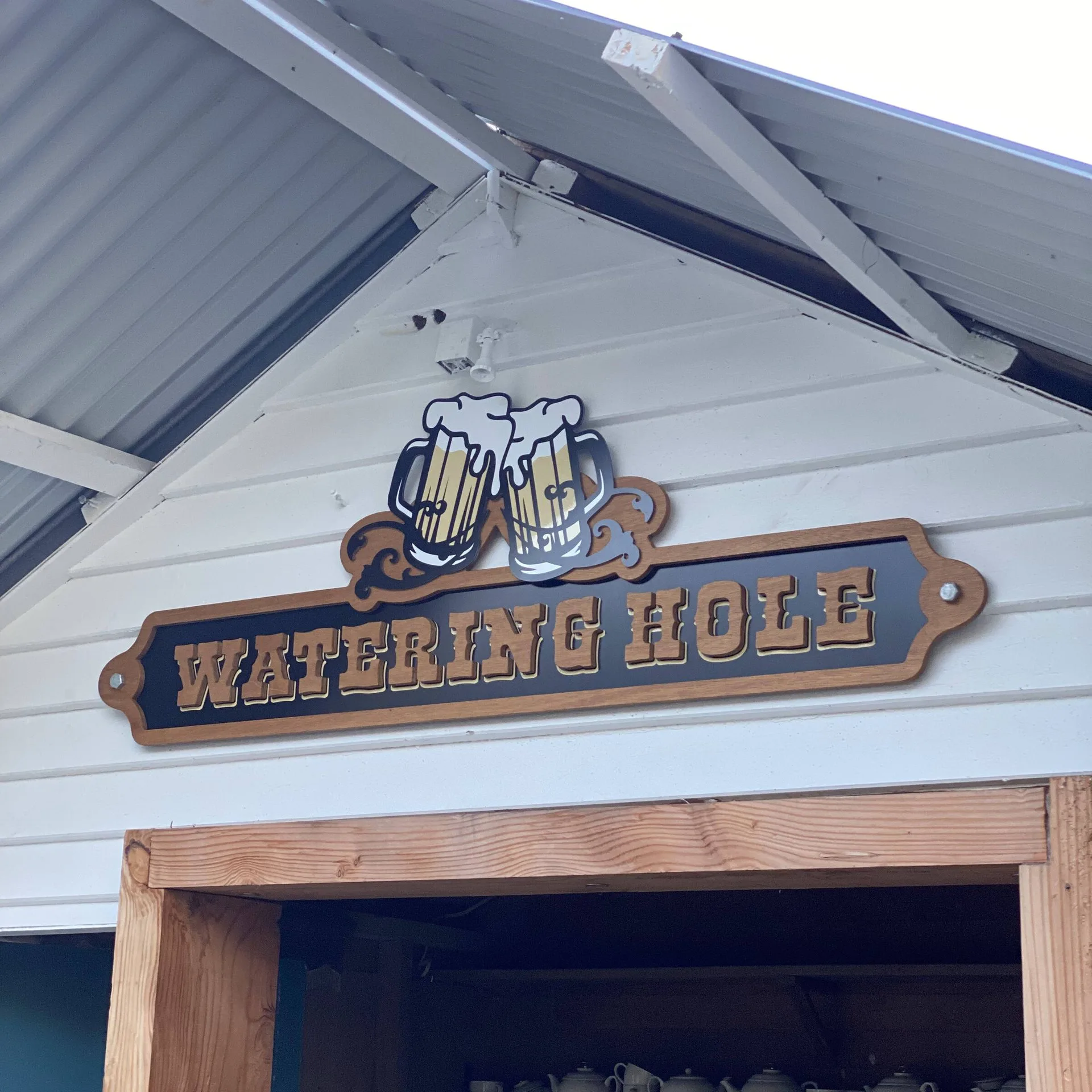 The Watering Hole — Exterior sign